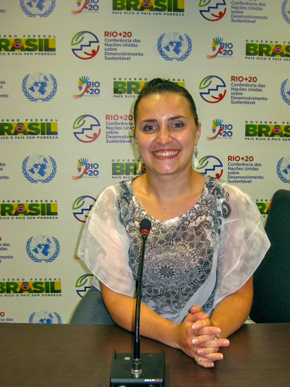 Woman in front of a mike at the Rio+20 conference in Rio de Janeiro, Brazil.