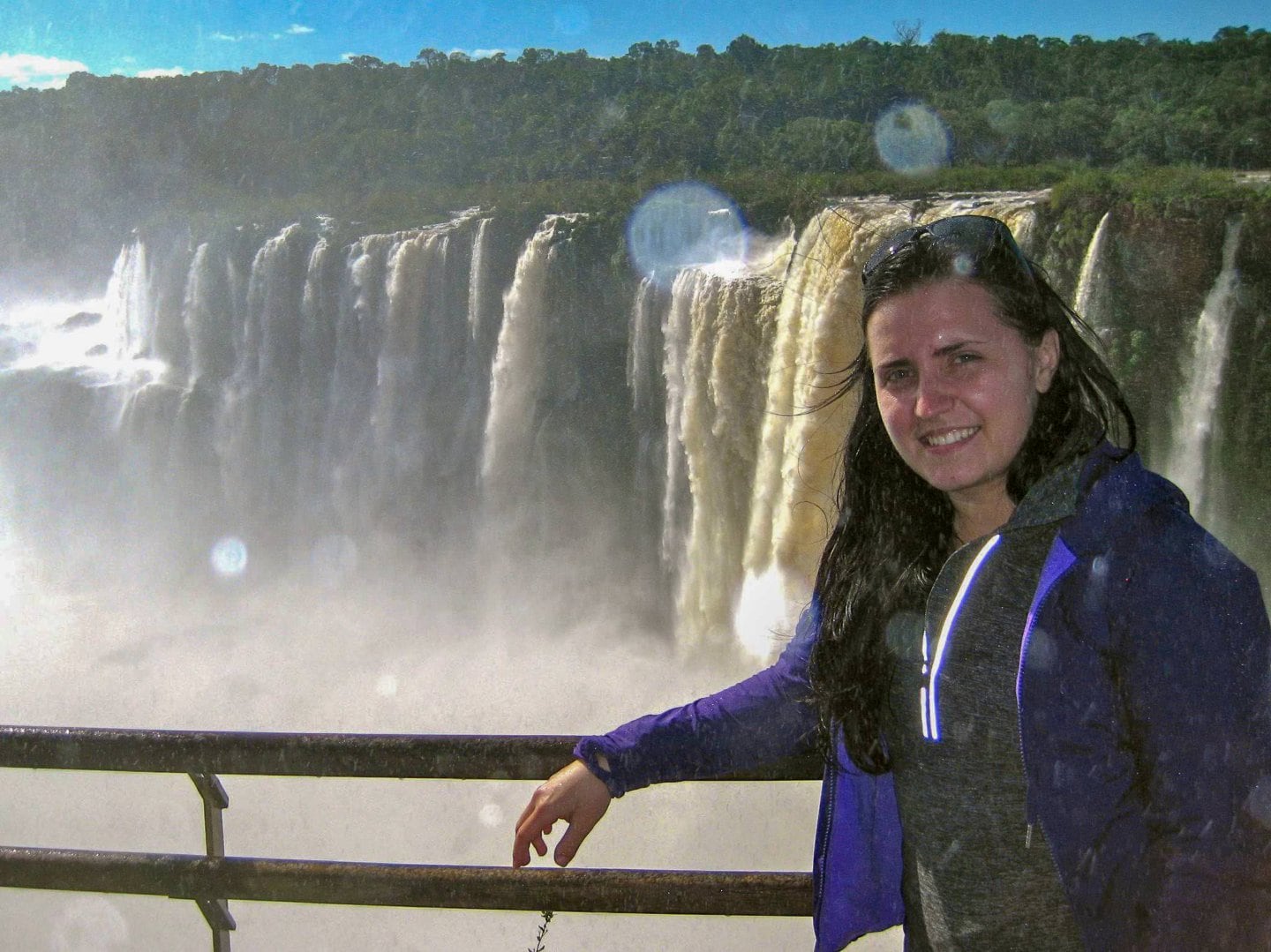 Girl in front of Iguazu Falls in Brazil.
