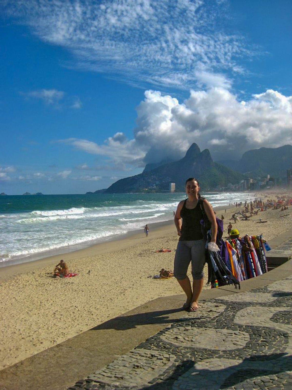 Woman walking on Copacabana beach in Rio de Janeiro, Brazil.