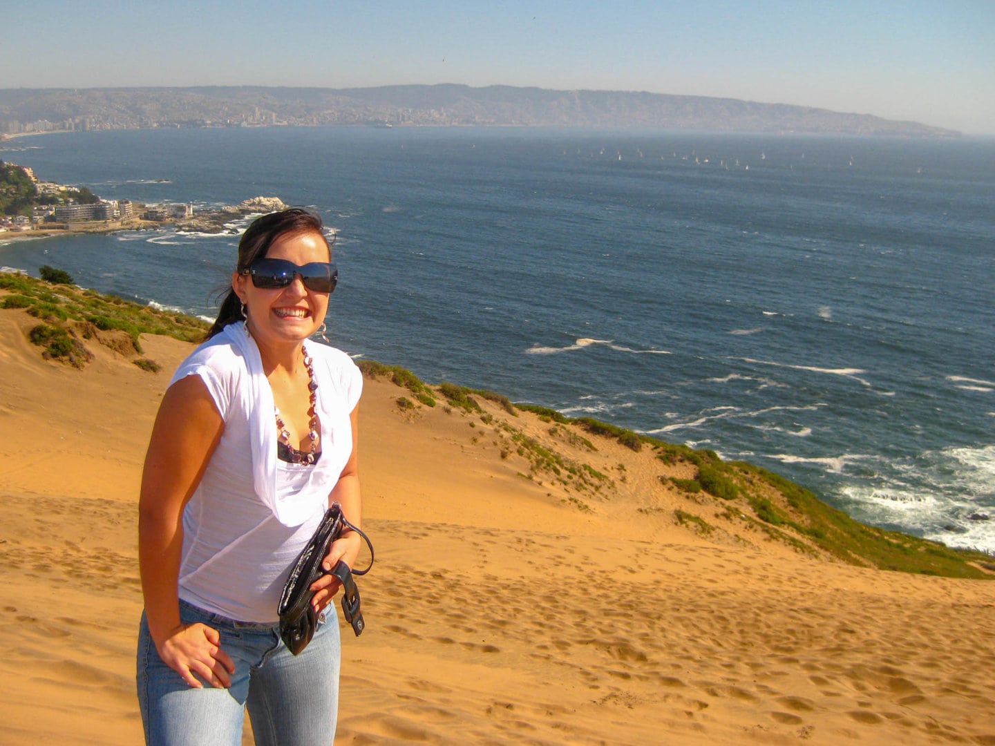 Girl on top of a sand dune near Viña del Mar in Chile.