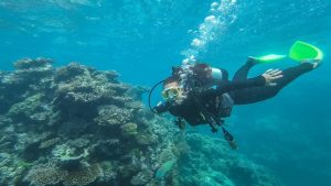 girl scuba diving the Great Barrier Reef in Australia