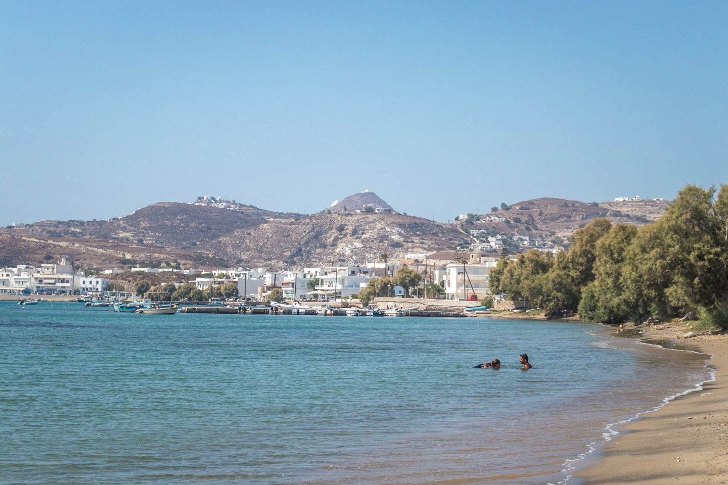 view of Papikinou beach with Adamas behind it