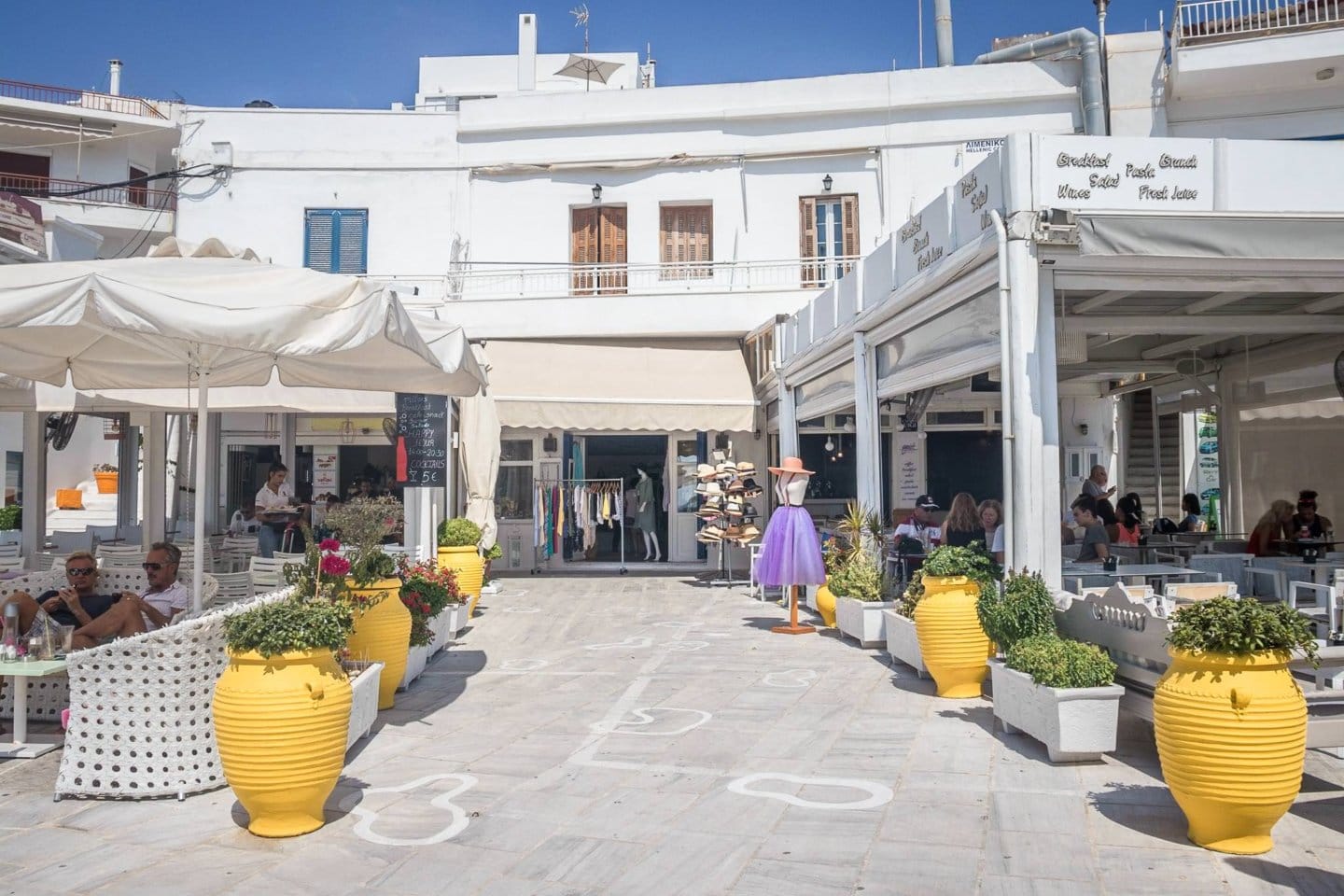 cafes and stores in the port city of Adamas, Milos