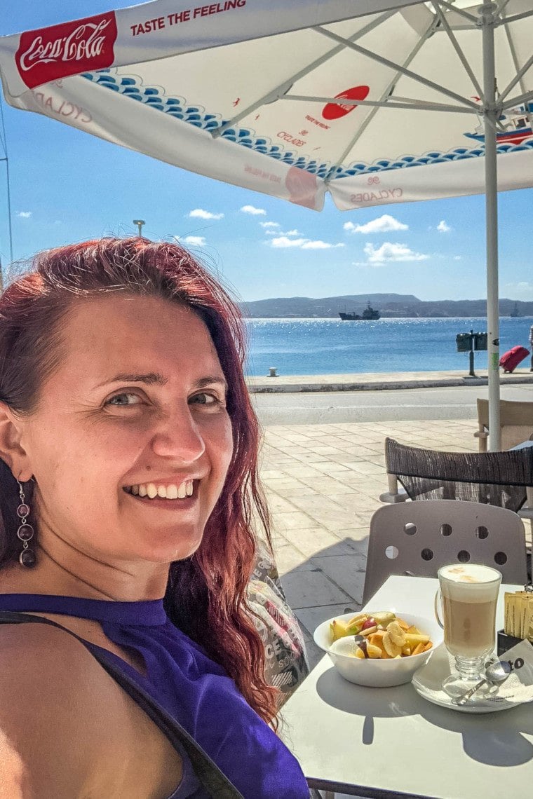 girl eating breakfast in Greece