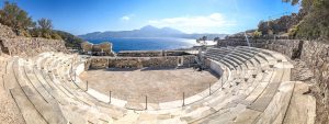 panoramic of the theatre of Milos with the bay of Milos in the background