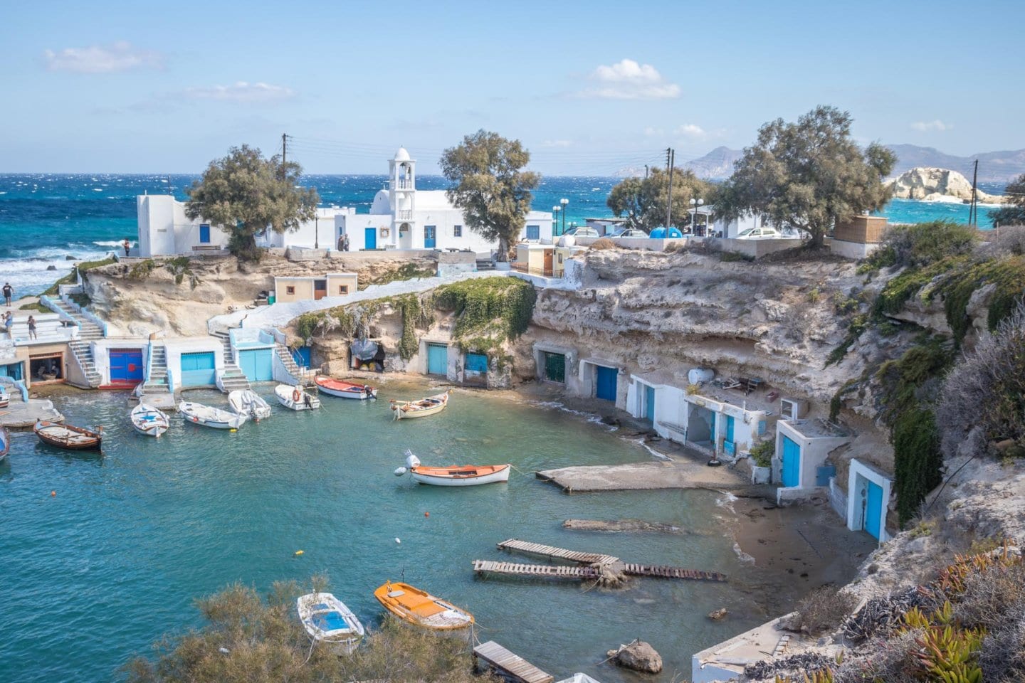 a row of colorful fishing houses in Mandrakia village in Milos
