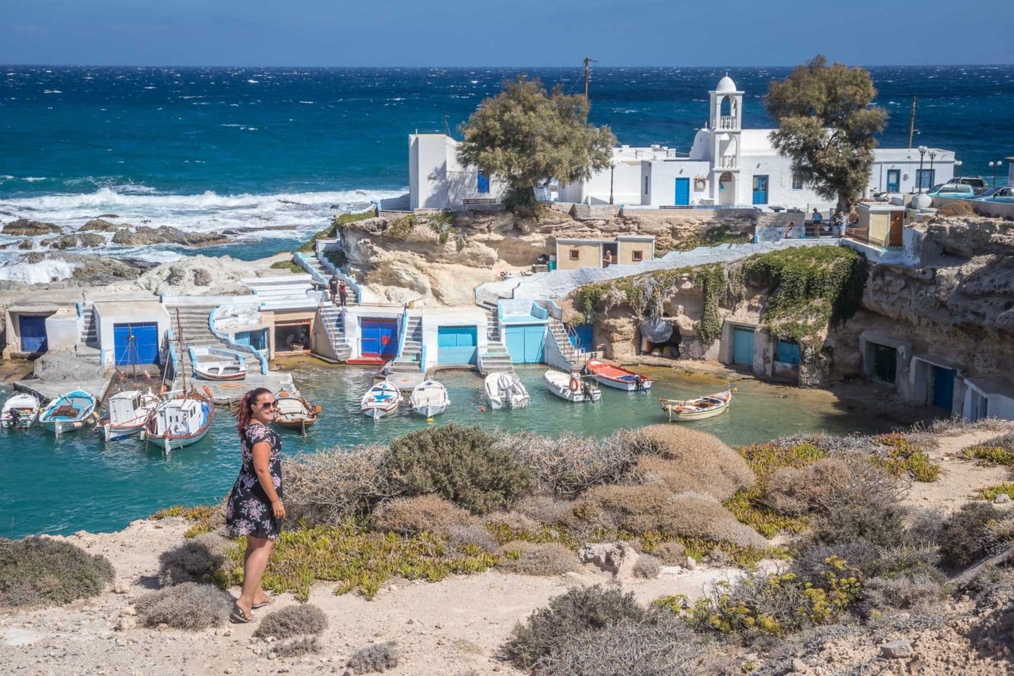 girl in front of Mandrakia fishing village in Milos