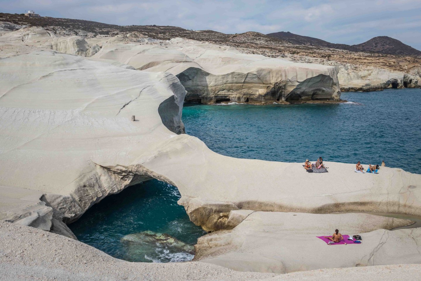 sunbathers at Sarakiniko beach