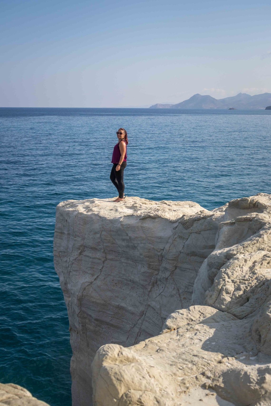 girl standing on a rock