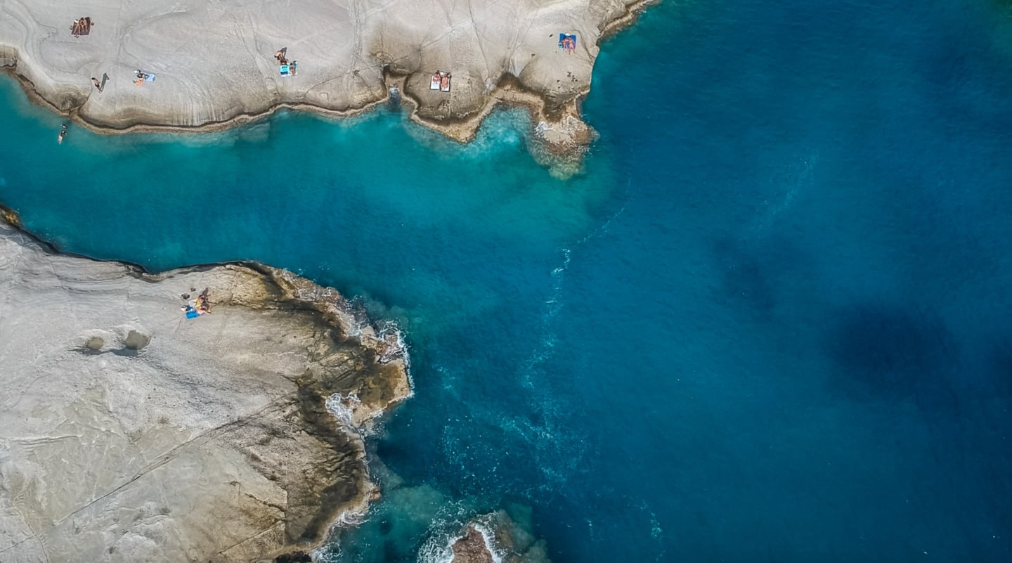 drone view of sunbathers at Sarakiniko beach