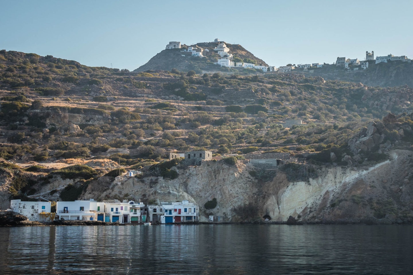 view of Plaka on top of a hill from a boat