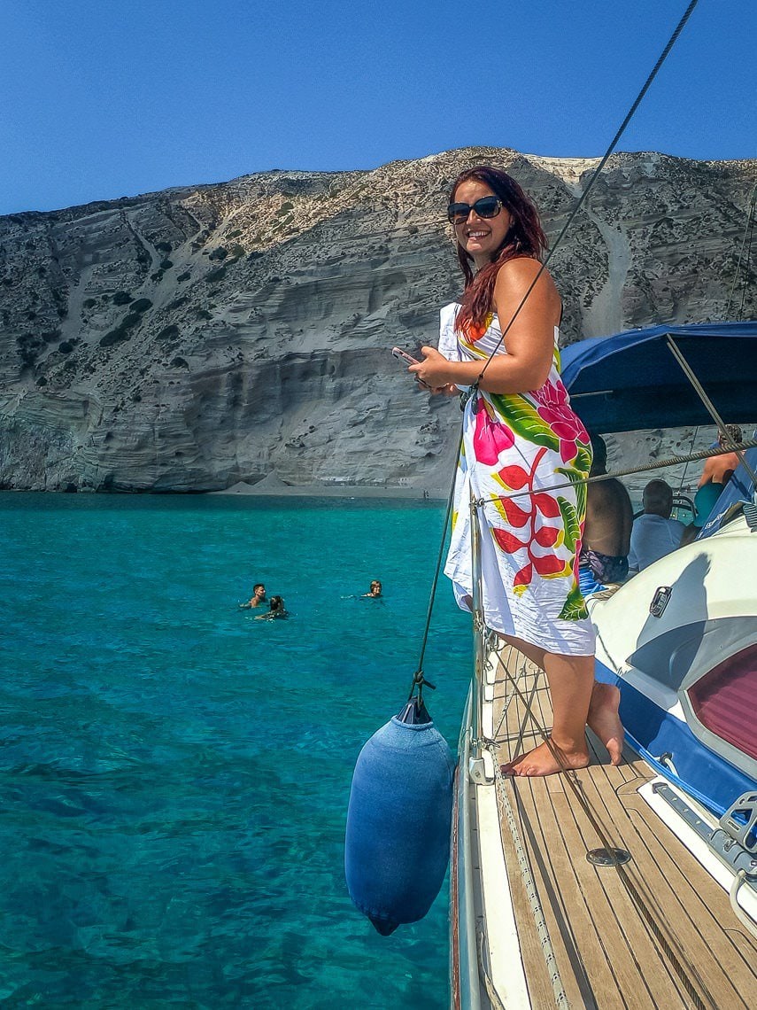 girl on a yacht in front of Gerontas beach in Milos