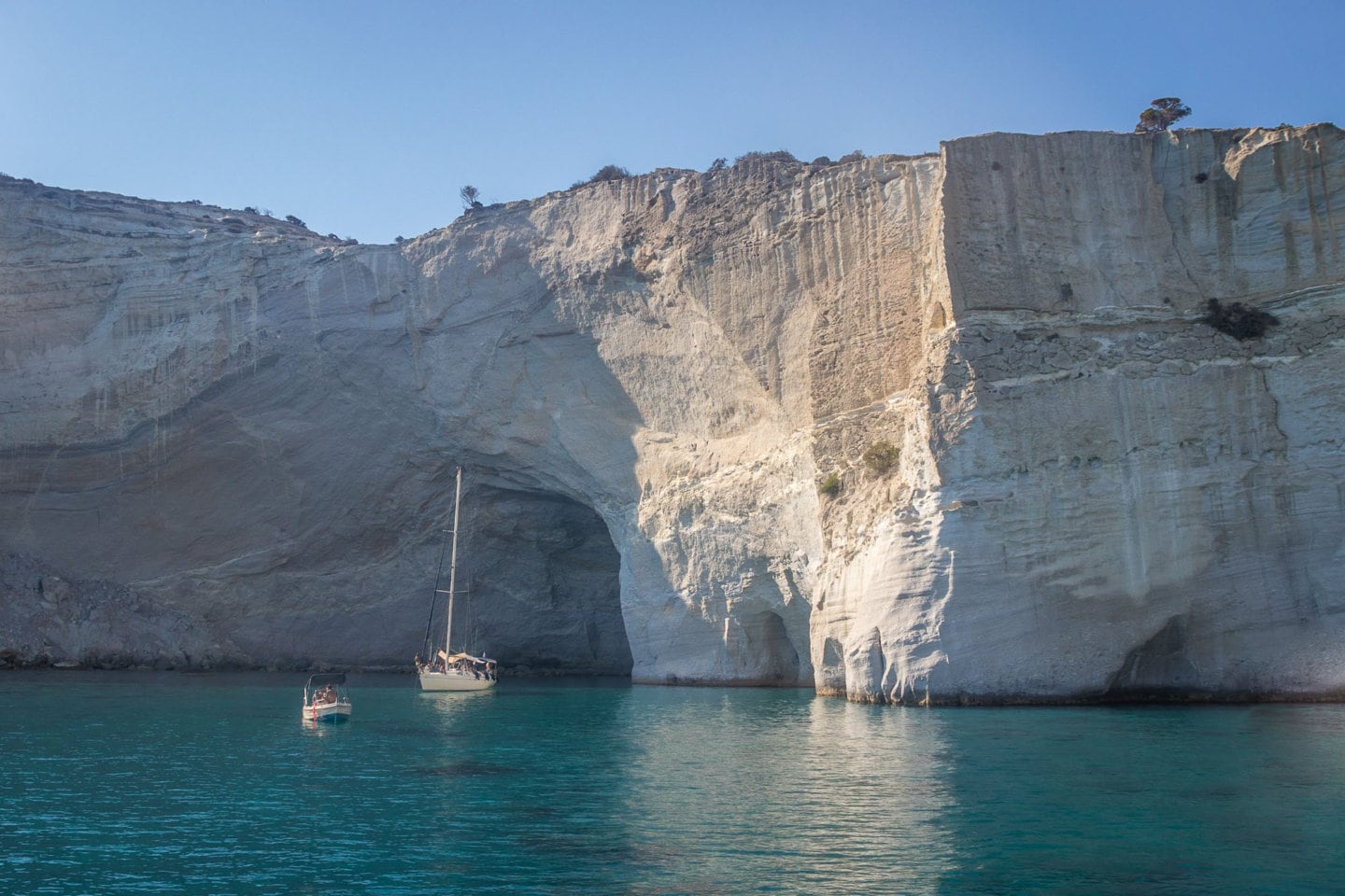 boats anchored at Kleftiko Bay on Milos Island in Greece