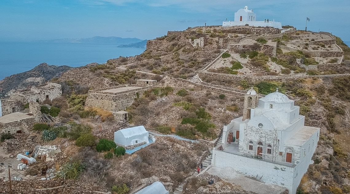 drone view of Milos castle and the two churches on the hill