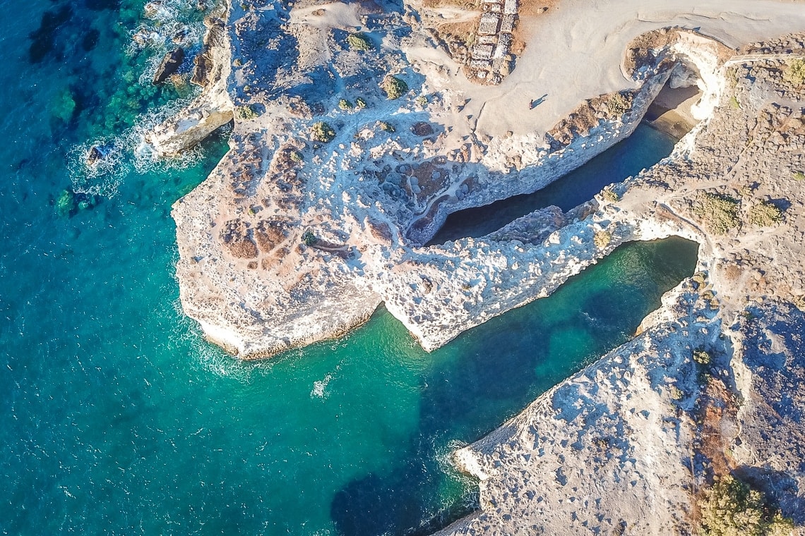 drone view of Papafragas beach cave and cliffs