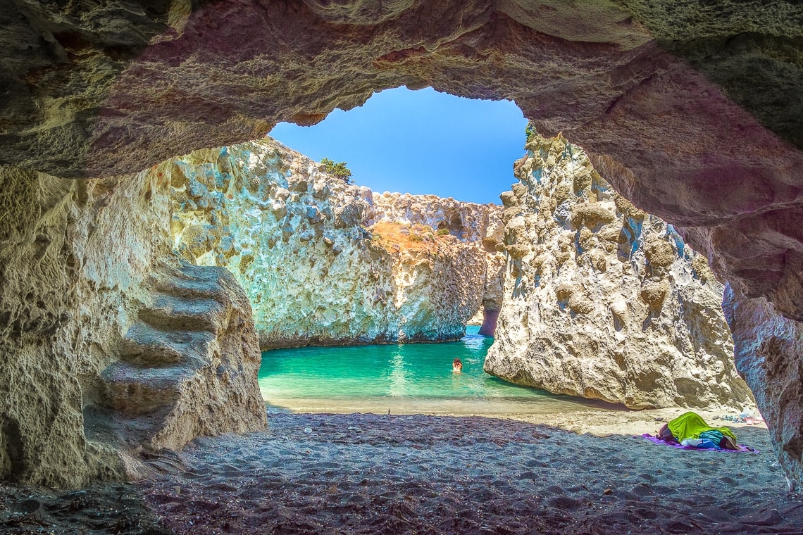 view of a woman swimming by herself at Papafragas beach
