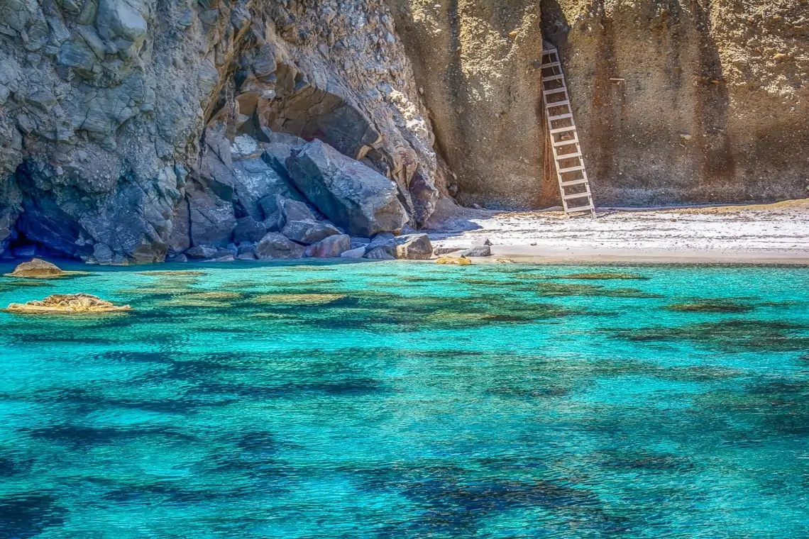 view of a ladder on Tsigrado beach captured from the water