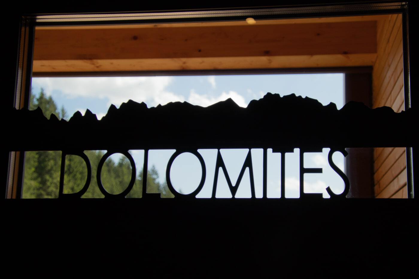 Dolomites sign on a door at qc terme spa in val di fassa trentino region