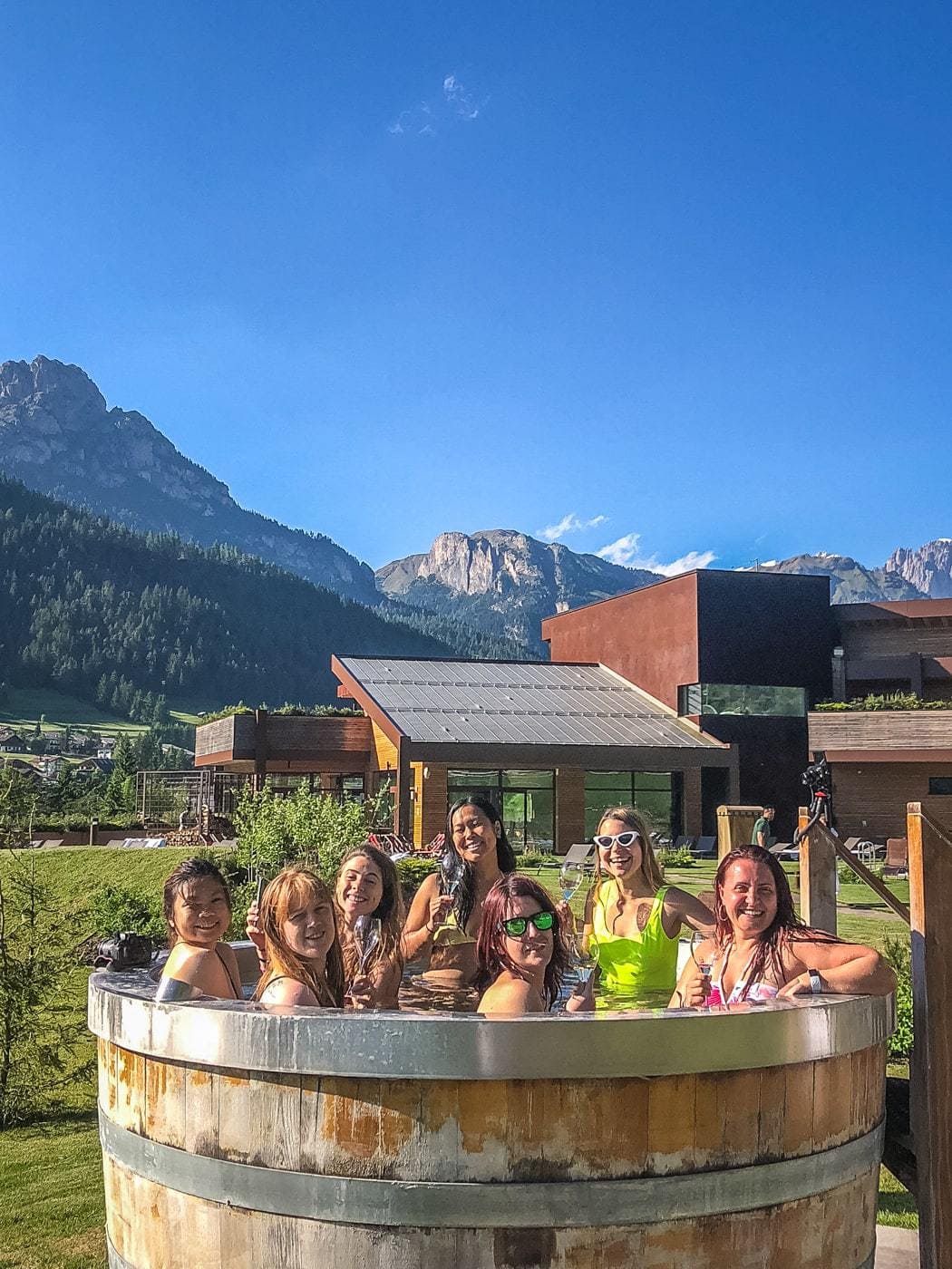 a group of women influencers in a hot tub at qc terme dolomiti
