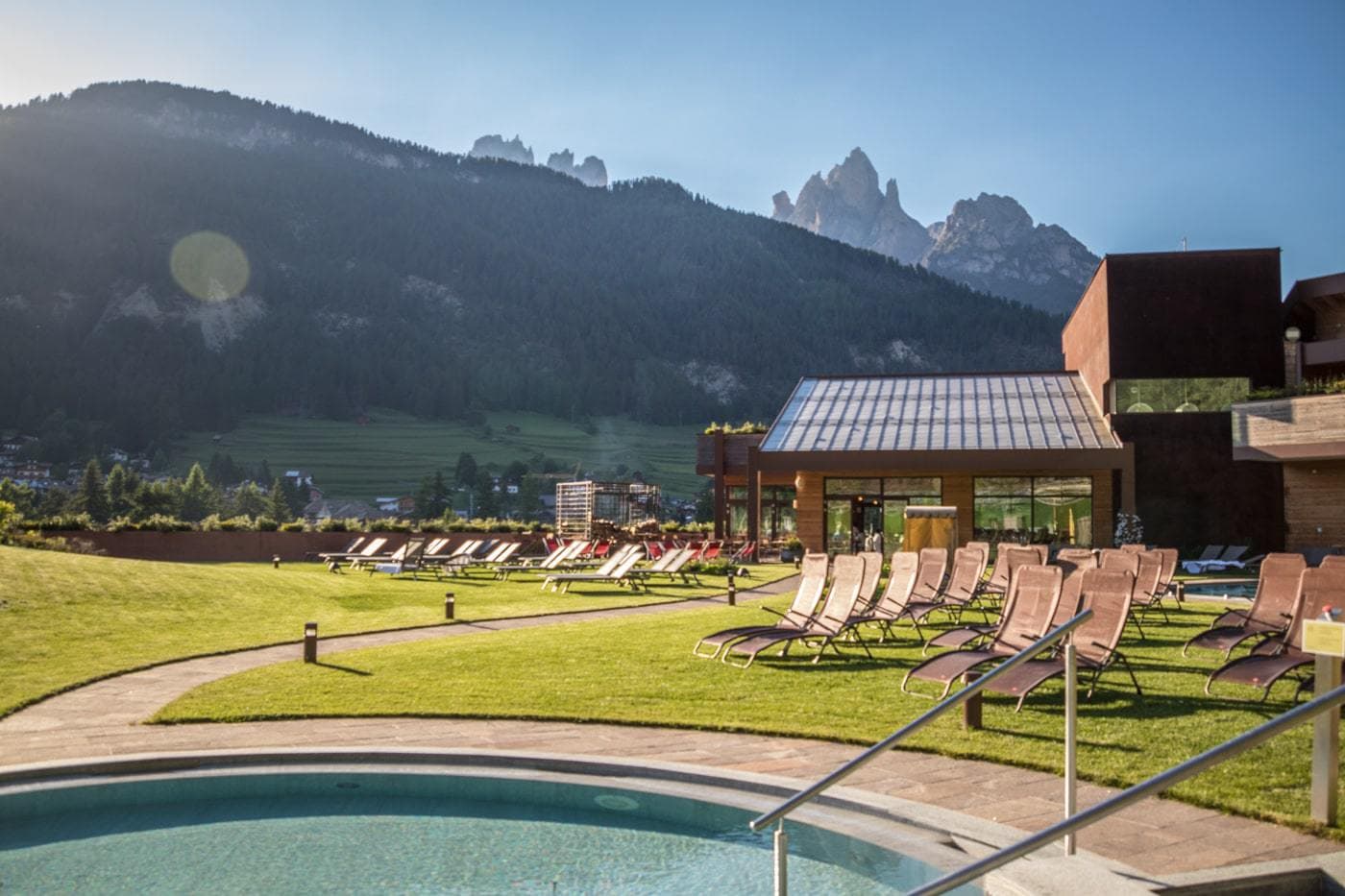 lawn chairs outside of qc terme spa in trentino region