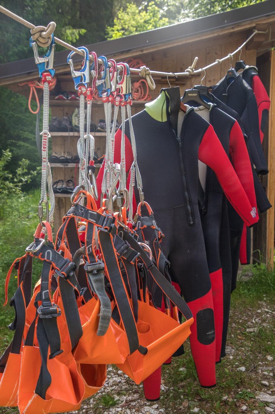 canyoning suits hanging and waiting to be put on