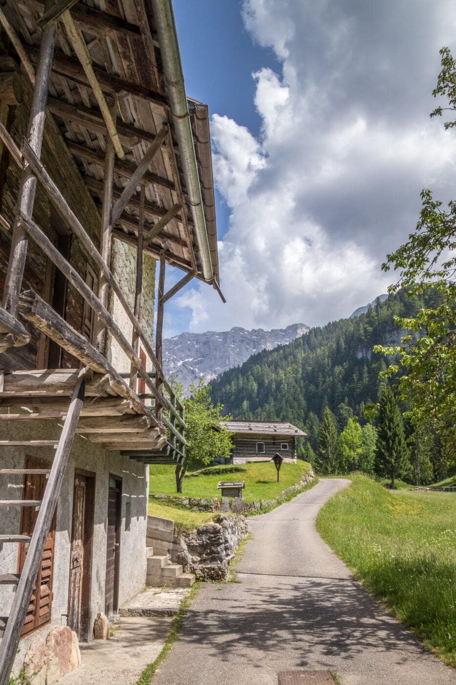 scenery in the Trentino area with mountain huts surrounded by the Dolomites