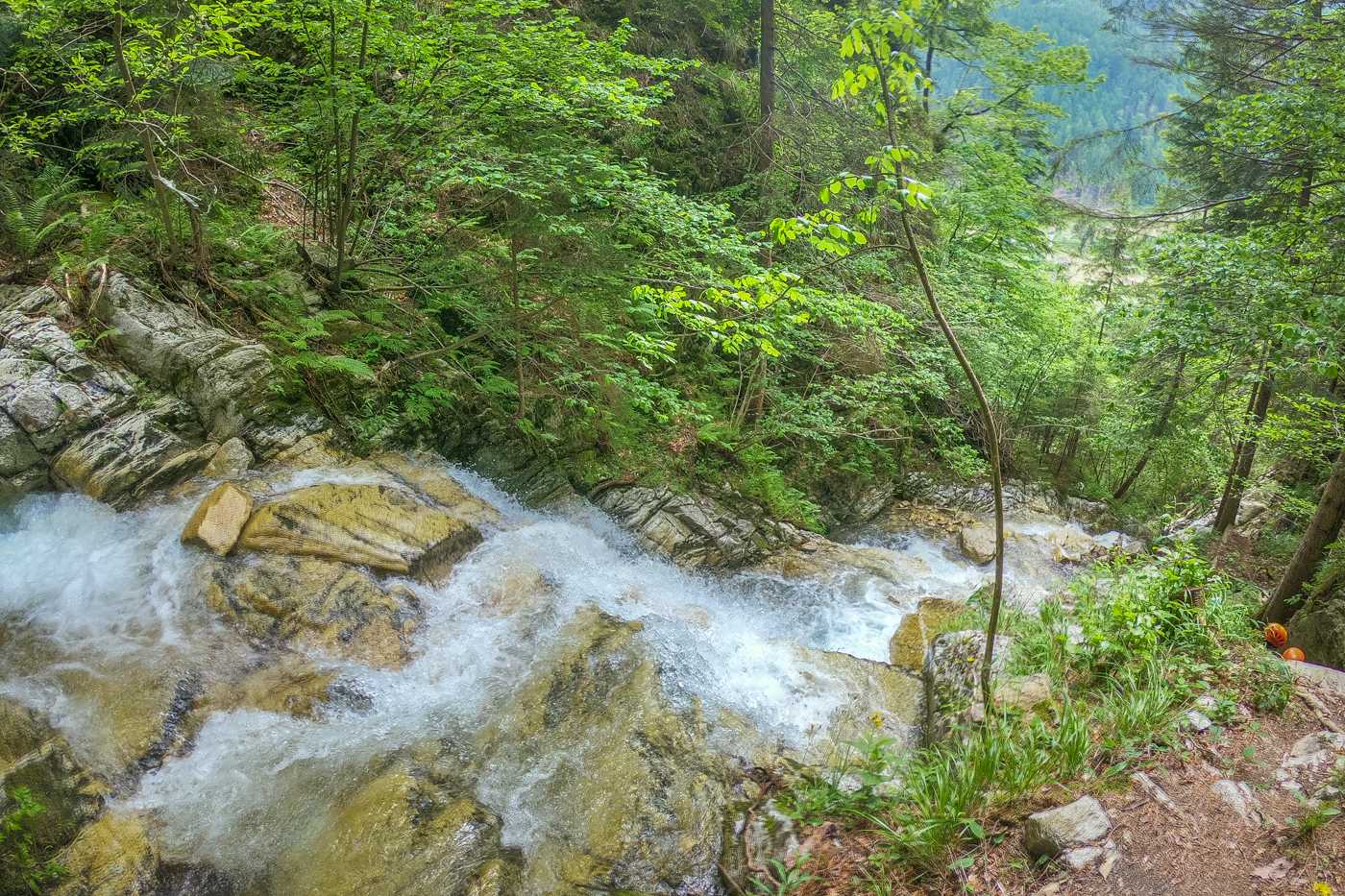 view of a waterfall in valle del vanoi trentino