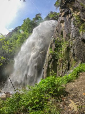 waterfall in Valle del vanoi in trentino with a steel staircase route