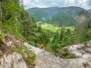 women getting to the top of a via ferrata route in trentino italy