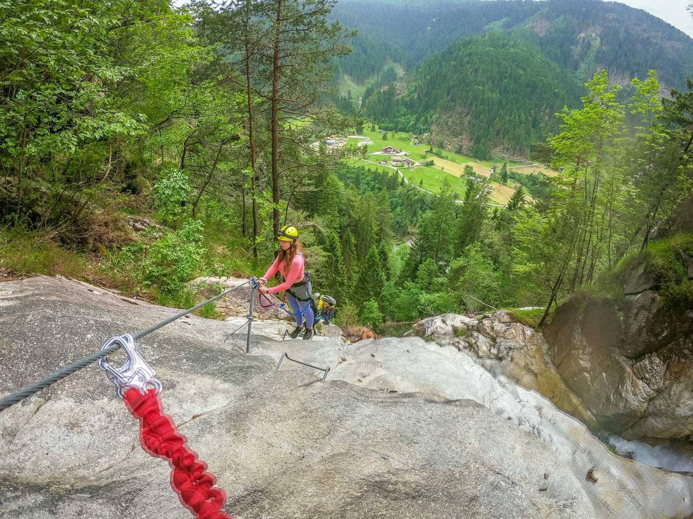 women getting to the top of a via ferrata route in trentino italy