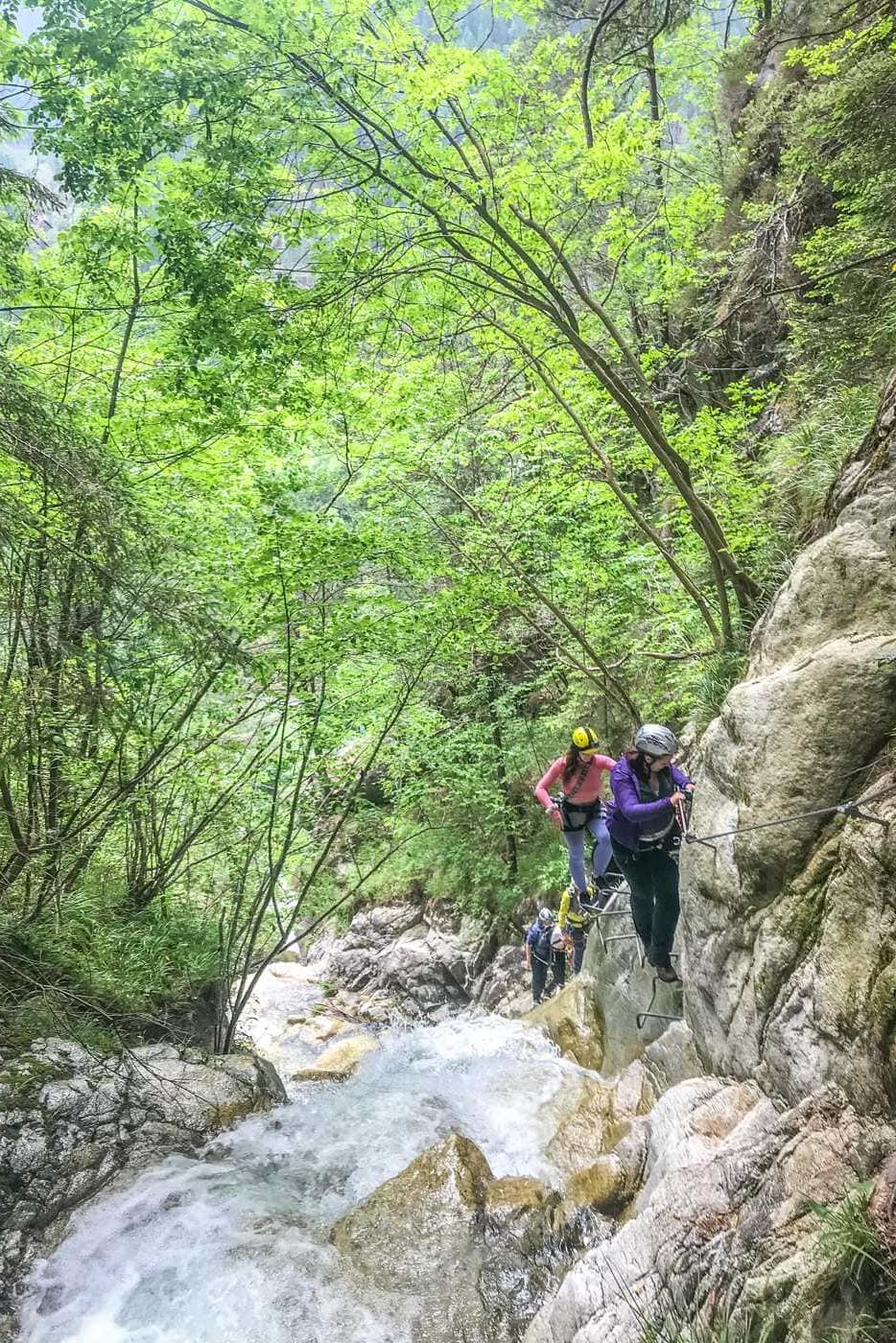 women climbing via ferrata val di scala in valle del vanoi italy