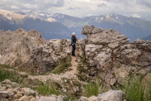 woman surrounded by the dolomite mountains