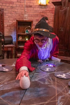 the alchemist holding the prop dragon egg