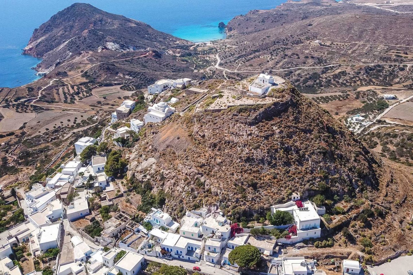 drone view of kastro castle and plaka in milos