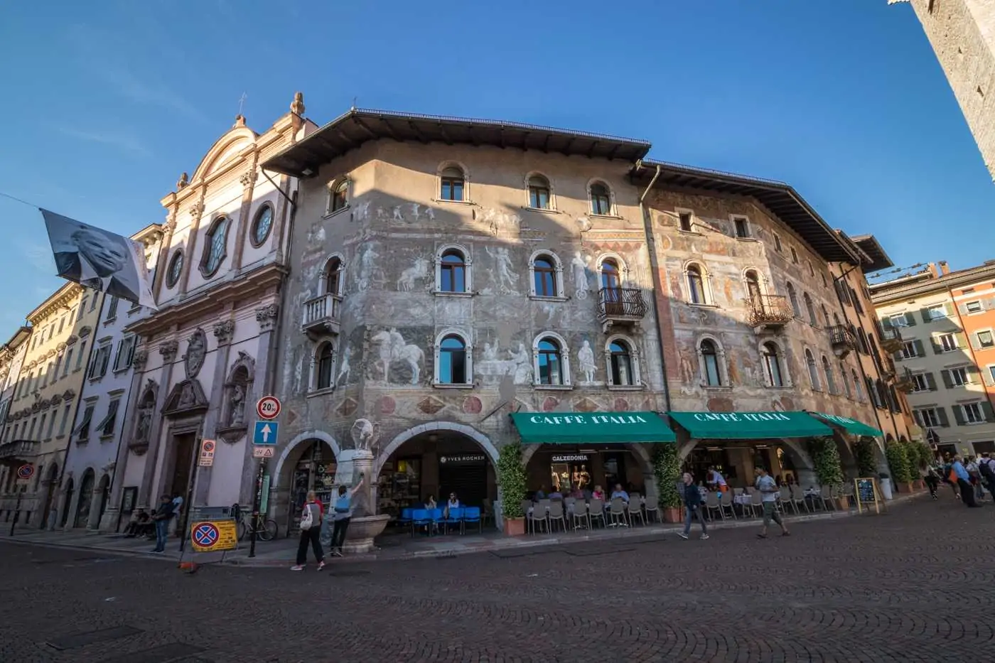 painted frescoes on buildings in piazza duomo trento